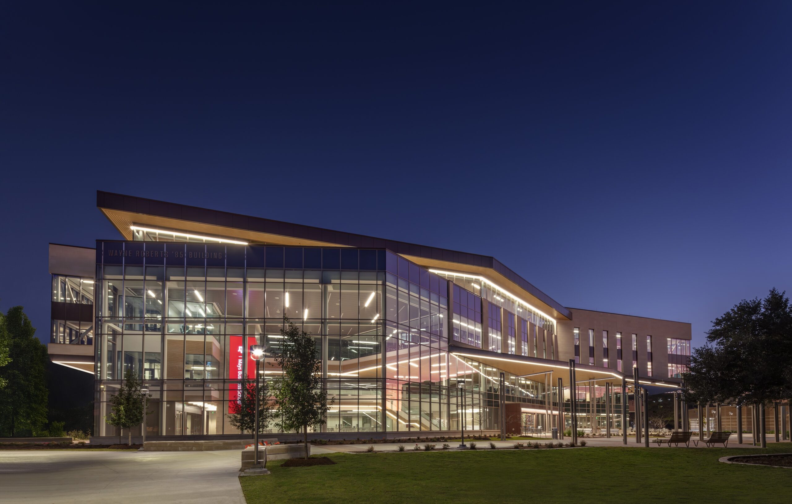The illuminated Wayne Roberts ’85 Building at Texas A&M at dusk